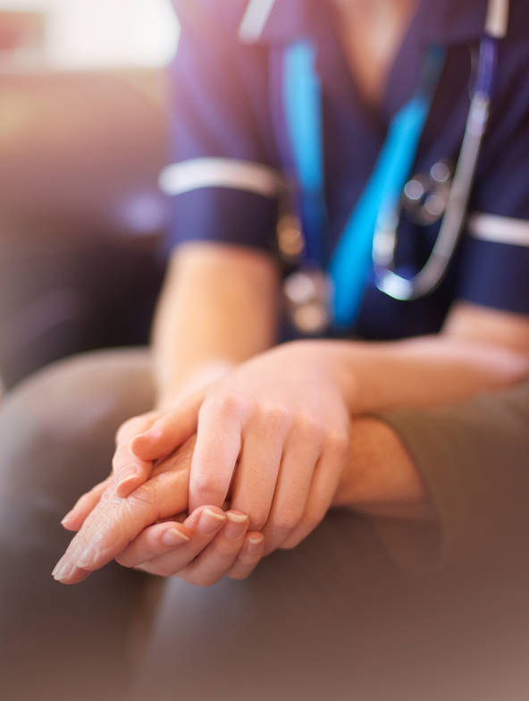Nurse holding patients hands Nurse holding patients hands